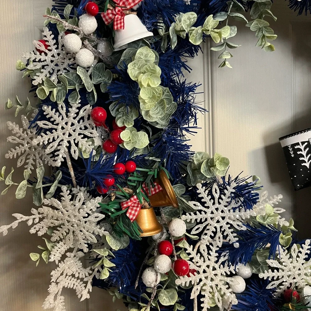 Elegant Blue and White Holiday Wreath with Red Accents